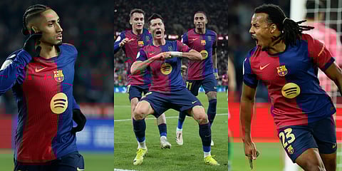 Barcelona's Raphinha (L), Lewandowski (C) and Kounde