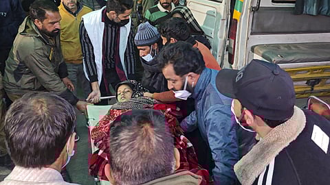 A patient from Badhal village being taken to a hospital amid the deaths of at least 17 people belonging to three families, under suspicious circumstances, in Jammu and Kashmir's Rajouri district