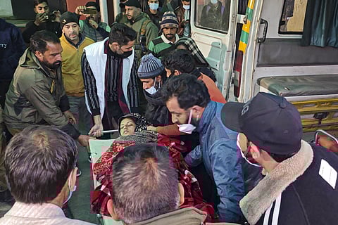 A patient from Badhal village being taken to a hospital amid the deaths of at least 17 people belonging to three families, under suspicious circumstances, in Jammu and Kashmir's Rajouri district