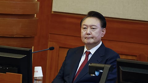 South Korea's impeached President Yoon Suk Yeol attends the fourth hearing of his impeachment trial over his short-lived imposition of martial law at the Constitutional Court in Seoul, South Korea, Thursday, Jan. 23, 2025.