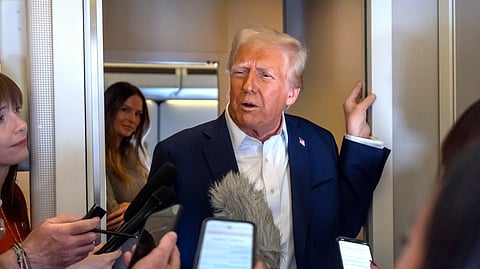 resident Donald Trump speaks to reporters aboard Air Force One as he travels from Las Vegas to Miami on Saturday