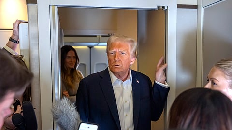 US President Donald Trump speaks to reporters aboard Air Force One as he travels from Las Vegas to Miami on Saturday, Jan. 25, 2025.