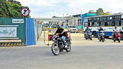Vehicles ply on Kamaraj Road in Bengaluru