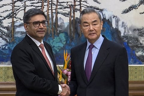 In this image taken from a video footage run by Phoenix TV, Chinese Foreign Minister Wang Yi, right, meets with India's Foreign Secretary Vikram Misri in Beijing, Monday, Jan. 27,