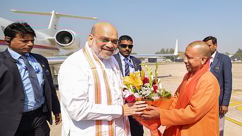 Union Home Minister Amit Shah being welcomed on his arrival by Uttar Pradesh CM Yogi Adityanath, in Prayagraj.