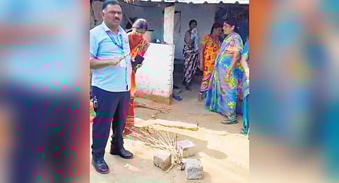 A novel protest held by the Telangana Grameena Bank staff in front of the debtor residence.