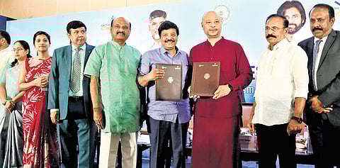 Tourism Minister Kandula Durgesh exchanging signed MoUs at the Regional Tourism Investors Conclave at Visakhapatnam on Monday