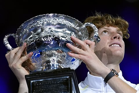 Jannik Sinner of Italy holds the Norman Brookes Challenge Cup aloft after defeating Alexander Zverev of Germany in the men's singles final at the Australian Open tennis championship in Melbourne, Australia, Sunday, Jan. 26, 2025.