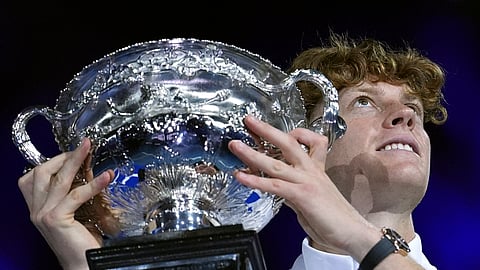 Jannik Sinner of Italy holds the Norman Brookes Challenge Cup aloft after defeating Alexander Zverev of Germany in the men's singles final at the Australian Open tennis championship in Melbourne, Australia, Sunday, Jan. 26, 2025.