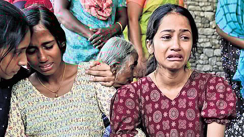 Sudhakaran’s daughters Akhila and Athulya sobbing as the bodies of their father and grandmother are brought home on Tuesday