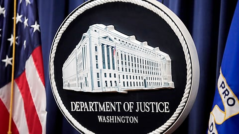 The logo for the Justice Department is seen before a news conference at the Department of Justice.