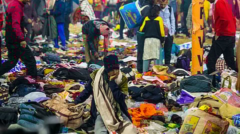 Devotees look for their belongings after a "stampede-like" situation broke out on Mauni Amavasya during the ongoing Mahakumbh Mela
