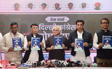 Congress leaders Jairam Ramesh, center, Pawan Khera, second left, and Udit Raj, left, with Delhi Congress President Devender Yadav, second right, and others during the release of the partyÂ’s manifesto for the upcoming Delhi Assembly elections, in New Delhi, Wednesday, Jan. 29, 2025.