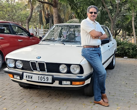 Ranjit Pratap in front of a 1985 BMW 525