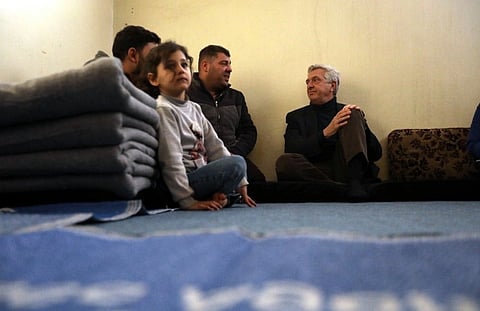 UN High Commissioner for Refugees, Filippo Grandi (right), meets Issa (centre) and his family, who recently returned to Aleppo from Kahramanmaraş in Türkiye.