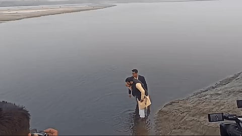 Haryana Chief Minister Nayab Singh Saini takes a sip of Yamuna water.
