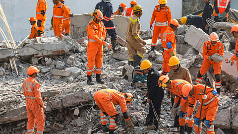 : Rescue work underway after a four-storey building collapsed, at Burari area, in New Delhi, Tuesday.