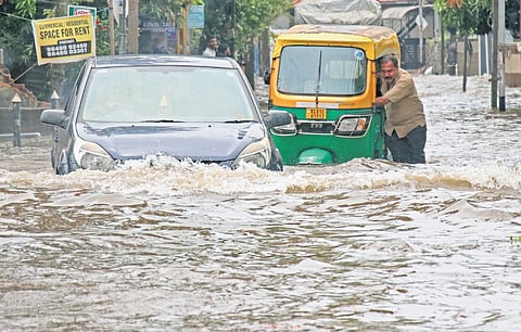 Motorist caught up in the flooded city roads as unexpected rain lashed the city last year
