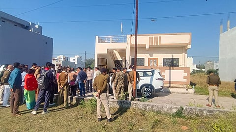 Police and residents outside the rented house in which CRPF jawan allegedly shot his wife dead before killing himself in a similar fashion