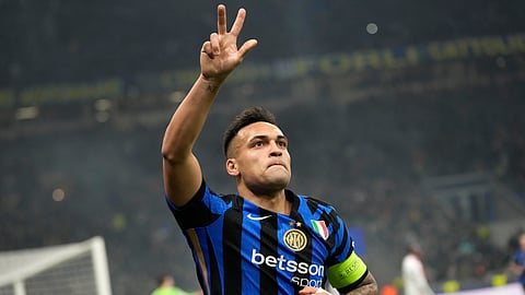 Inter Milan's Lautaro Martinez flashes up his three fingers as he's celebrates his third goal against Monaco during a Champions League opening phase soccer match between Inter Milan and Monaco on Jan. 29, 2025.