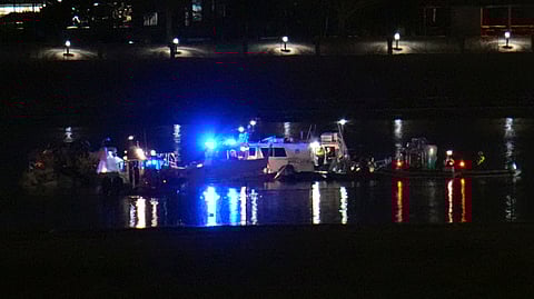 Rescuer workers respond to the scene on the Potomac River near Ronald Reagan Washington National Airport, Thursday, Jan. 30, 2025, in Arlington, Va.