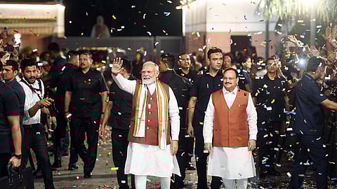Prime Minister Narendra Modi and BJP National President JP Nadda greet the party workers and leaders at the party headquarters in New Delhi.
