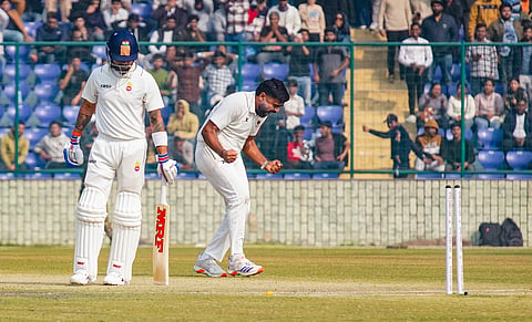 Himanshu Sangwan celebrates the wicket of Virat Kohli on the second day of the Ranji Trophy cricket match between Delhi and Railways at the Arun Jaitley Stadium in New Delhi (Photo | PTI)