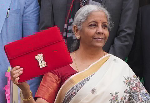 Union Finance Minister Nirmala Sitharaman wearing a saree featuring Madhubani art on her arrival at the Parliament House complex to present the Union Budget (Photo | PTI)