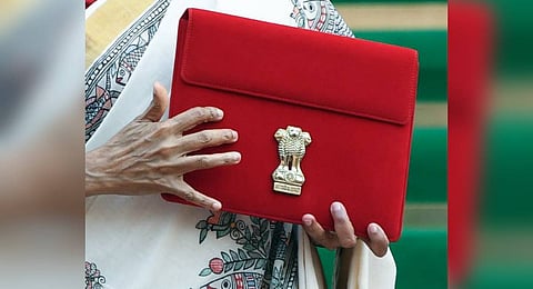 Union Finance Minister Nirmala Sitharaman (Unseen) carries the Budget Tablet as she arrives at Parliament House to present the Union Budget 2025, in New Delhi on Saturday.
