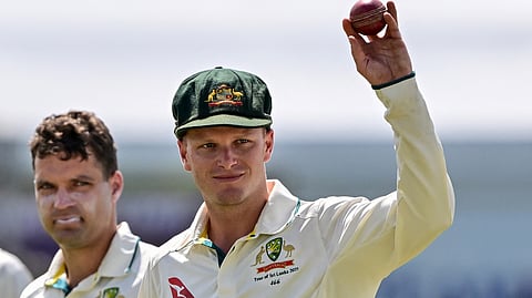 Australia's Matthew Kuhnemann celebrates after taking a five-wicket haul as he walks back to the pavilion at the end of Sri Lanka's second innings during the fourth day of the first Test at Galle (Photo | AFP)
