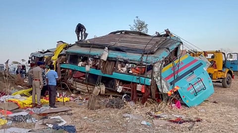 Wreckage of a bus is seen after it fell into a gorge, in Dang district, Gujarat on Sunday.