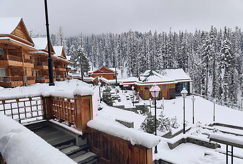 A view of snow-covered houses as the snow returns to the valley after a dry spell, at the Khyber resort in Gulmarg