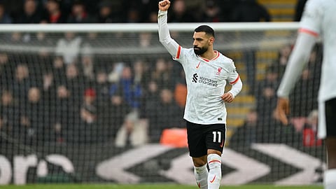Liverpool's Egyptian striker #11 Mohamed Salah celebrates after scoring the opening goal from the penalty spot during the EPL football match between Bournemouth and Liverpool on February 1, 2025.