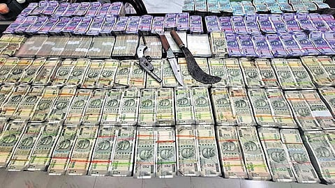 Kalahandi police seized a whopping Rs 3.51 crore robbed by a band of eight criminals from a country liquor manufacturing unit.