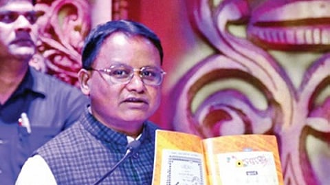 CM Mohan Charan Majhi with the reprinted edition of Barnabodha