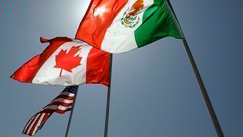 National flags representing the United States, Canada, and Mexico fly in the breeze in New Orleans where leaders of the North American Free Trade Agreement met on April 21, 2008.