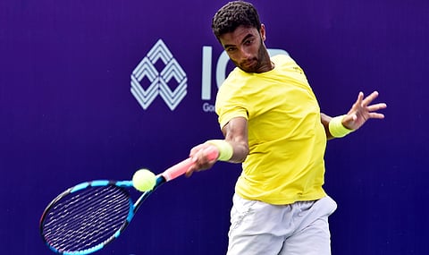 India's Manish Sureshkumar hits a return against Luca Castelnuovo in Round 1 of qualifying at the Chennai Open ATP Challenger on Sunday