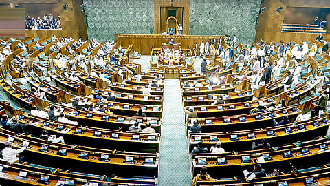 Opposition MPs stage a protest in the Lok Sabha during the Budget session of Parliament, in New Delhi, Monday.