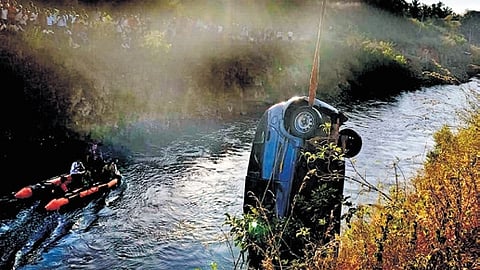 The car being lifted from Visvesvaraya Canal in Mandya on Monday