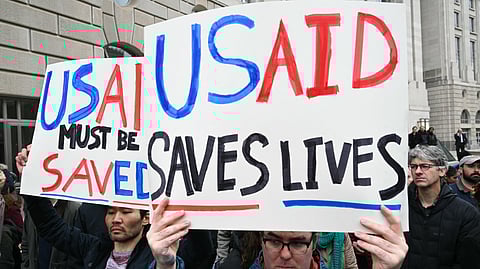 People protest outside of the headquarters for United States Agency for International Development (USAID)