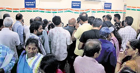 People crowd in the Stamps and Registration Department for property registrations.