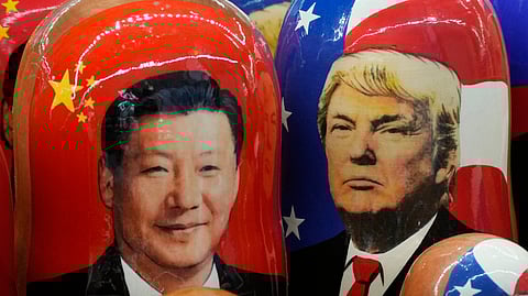 Matryoshka wooden dolls depicting China's President Xi Jinping, left, and U.S. President Donald Trump