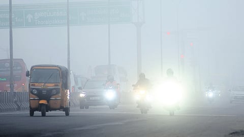 Dense fog impacting visibility for commuters on the Thoraipakkam radial road near Pallavaram on Tuesday morning