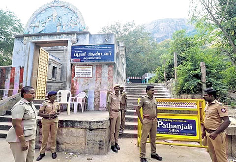 Policemen deployed in front of the entrance of Sikkandar dargah in Thiruparankundram on Wednesday