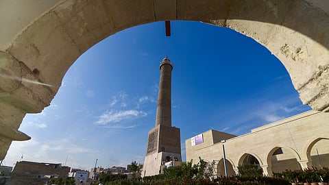 Builders work on the final stages of the reconstruction of the historic Great Mosque of al-Nuri, whose "Al-Hadba" leaning minaret which dates back to the 12th century was destroyed by Islamic State (IS) group fighters, in Mosul's old city in Northern Iraq on February 3, 2025.