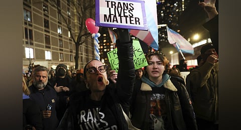 Protesters march during a rally demanding that NYU Langone commit to providing gender-affirming care for transgender youth following an executive order by President Donald Trump aimed at cutting federal funding, Monday, Feb. 3, 2025, in New York.