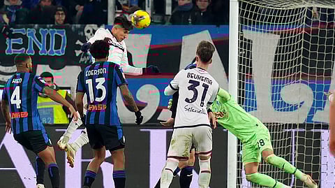 Bologna's Santiago Castro, center, scores during an Italian Italy Cup soccer match between Atalanta and Bologna, Tuesday, Feb. 4, 2025, at Gewiss Stadium in Bergamo, Italy.