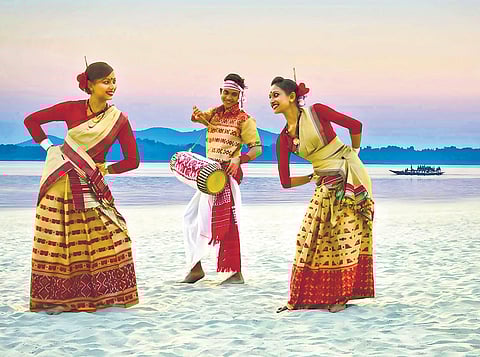 Assamese dancers on the banks of the Brahmaputra