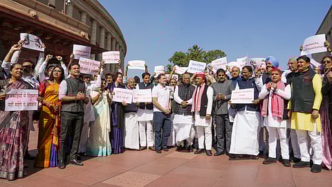 Congress President and LoP in the Rajya Sabha Mallikarjun Kharge with LoP in the Lok Sabha and party MP Rahul Gandhi, party MPs Priyanka Gandhi Vadraand others at a protest over the deportation of Indian immigrants from the US, at Parliament House complex during the Budget session.