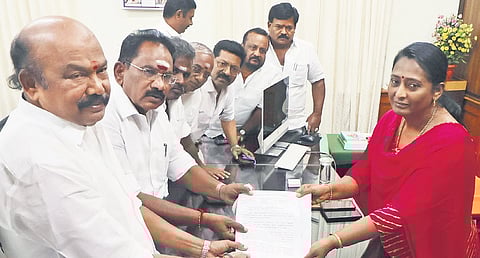 AIADMK party functionaries led by former minister Sellur K Raju on Thursday urged the district collector to withdraw her statement
